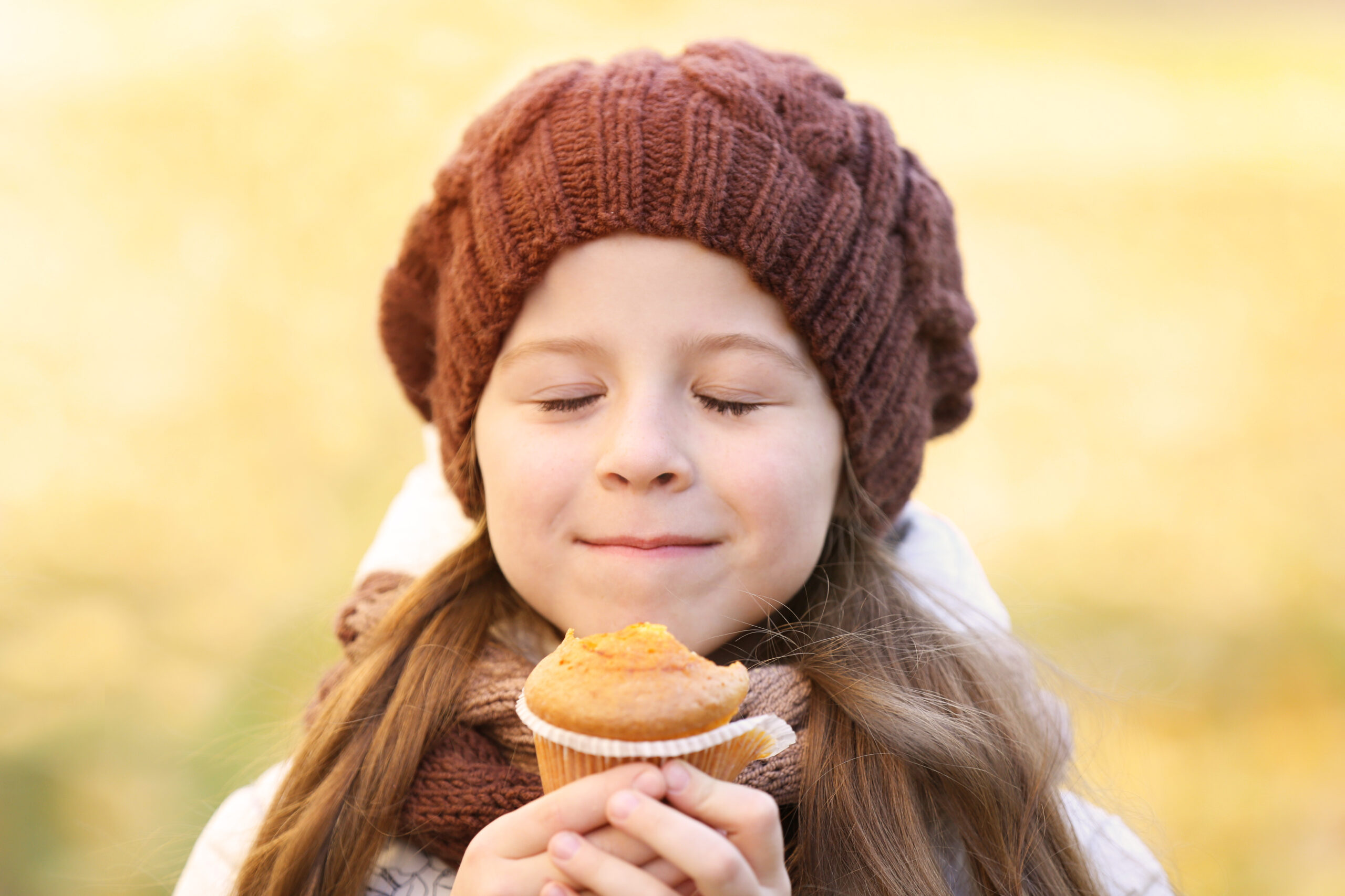 Cute,Little,Girl,Eating,Tasty,Muffin,Outdoors,,Close,Up,View